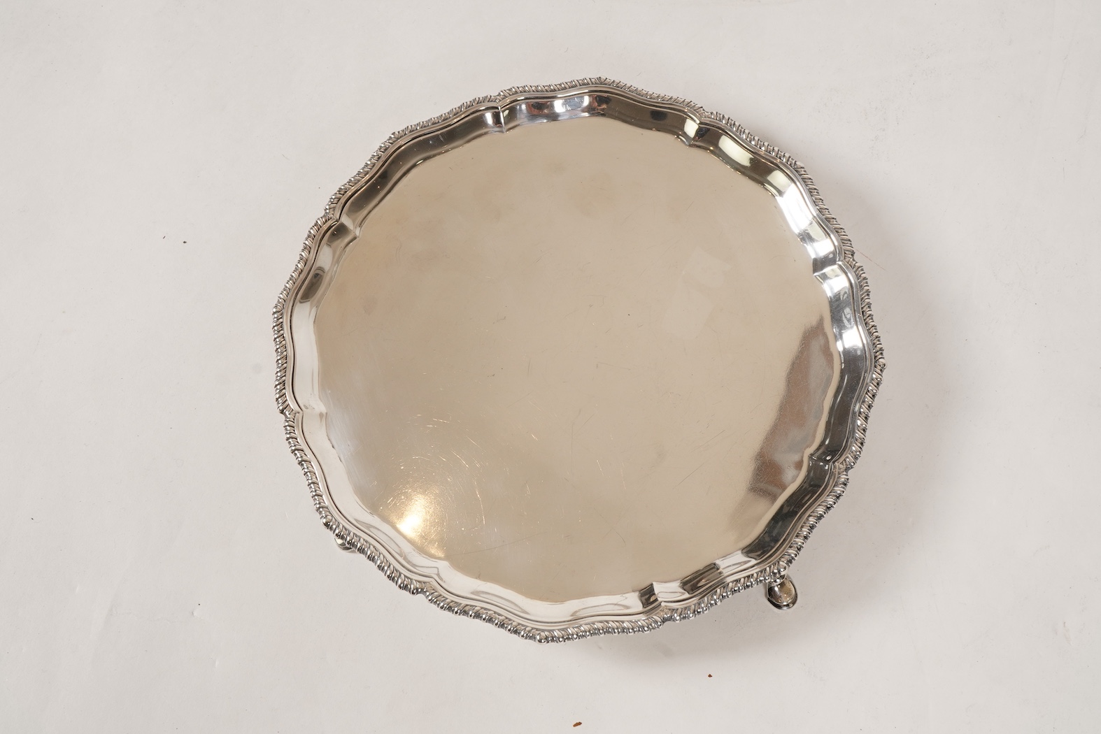 A George V silver salver, by Harrods Ltd